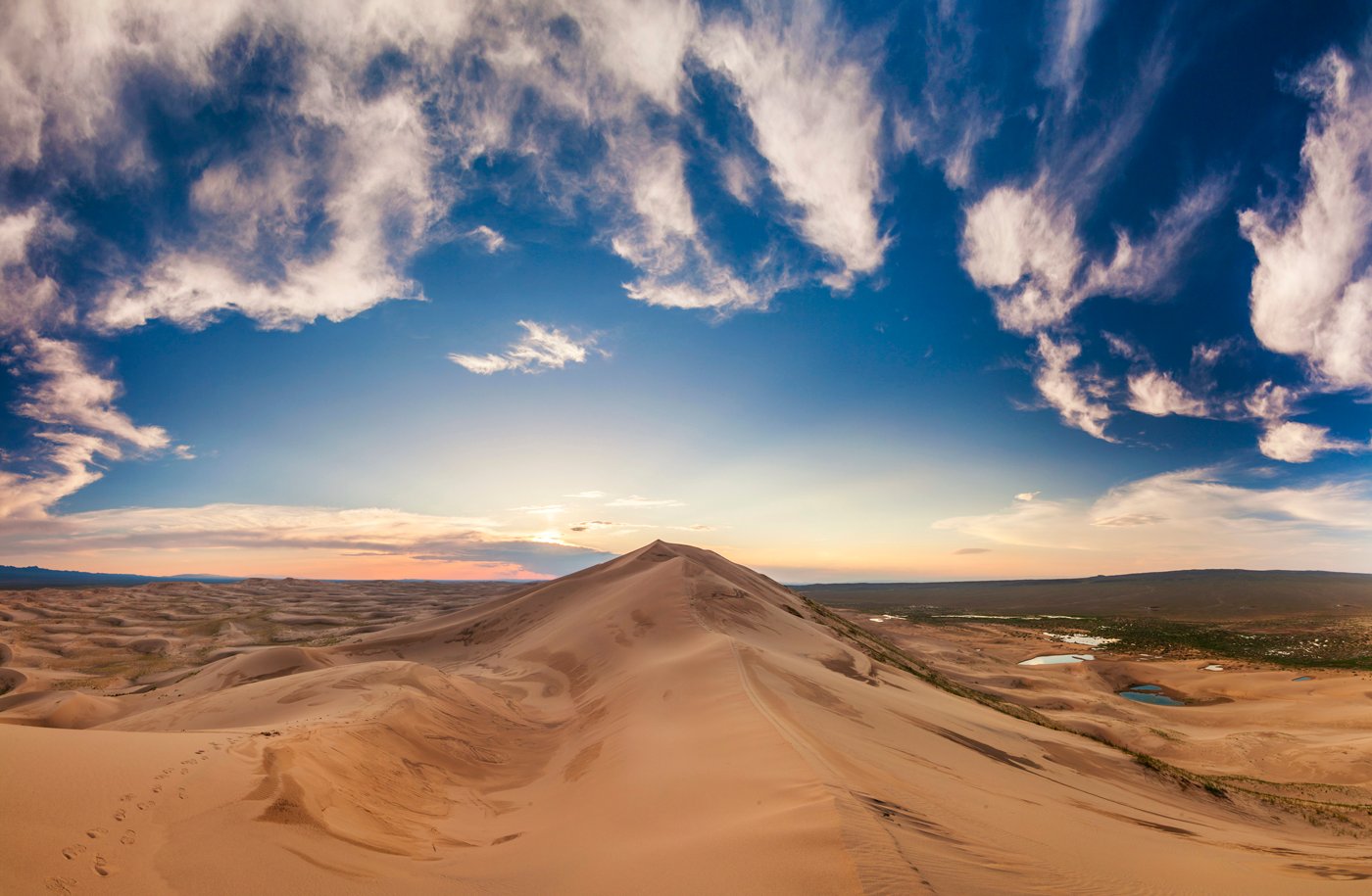 Colorful sunset over the dunes of the Gobi Desert. Mongolia.